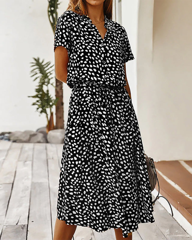 V-neck dress with dot print

Input: Blue striped button-up shirt
Output: Button-up shirt with blue stripes

Input: Floral print maxi dress
Output: Maxi dress with floral print

Input: Black leather ankle boots
Output: Ankle boots in black leather