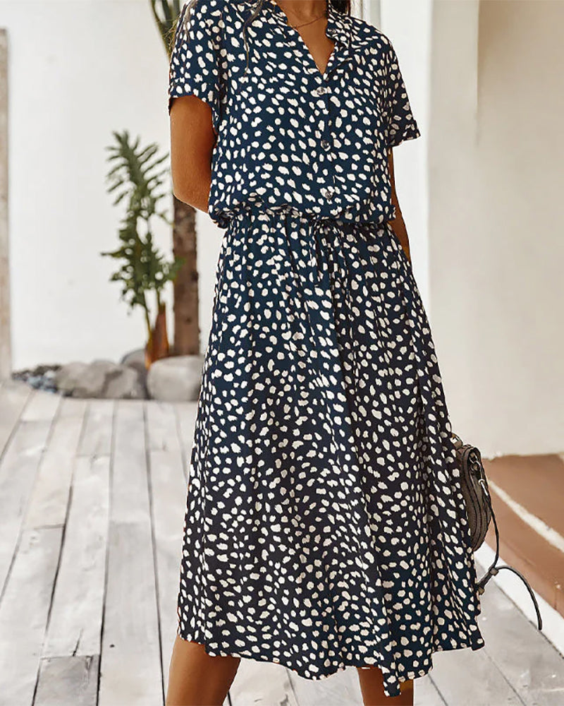 V-neck dress with dot print

Input: Blue striped button-up shirt
Output: Button-up shirt with blue stripes

Input: Floral print maxi dress
Output: Maxi dress with floral print

Input: Black leather ankle boots
Output: Ankle boots in black leather