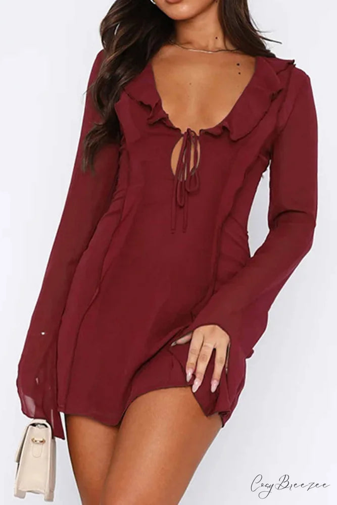 Long Sleeved Ruffled Mini Dress with Lace Up Detail