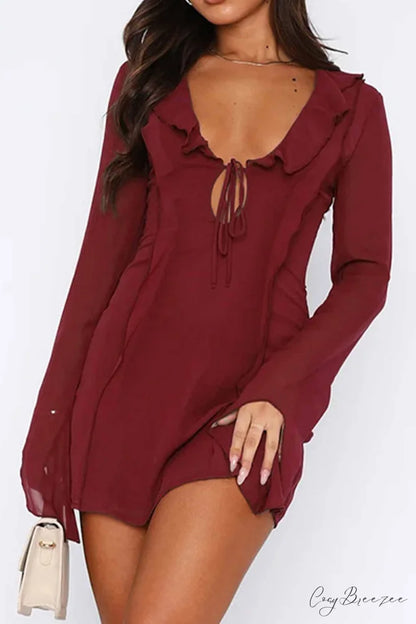 Long Sleeved Ruffled Mini Dress with Lace Up Detail