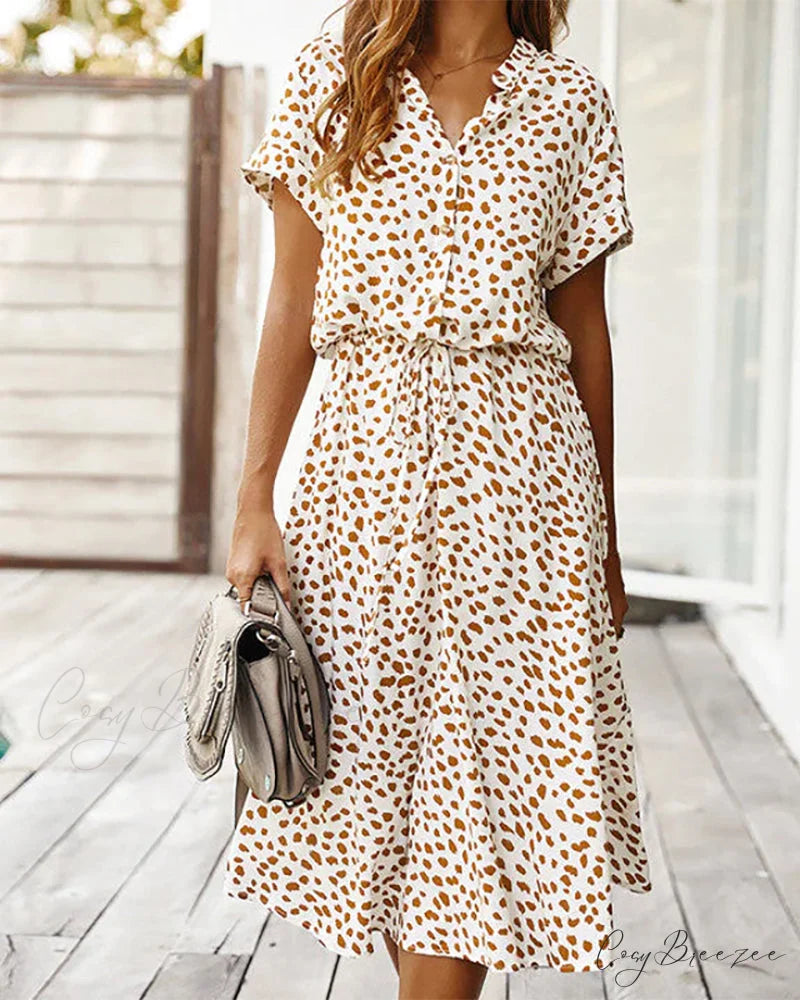 V-neck dress with dot print Input: Blue striped button-up shirt Output: Button-up shirt with blue stripes Input: Floral