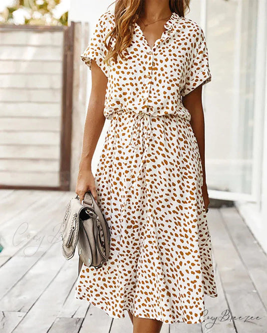 V-neck dress with dot print Input: Blue striped button-up shirt Output: Button-up shirt with blue stripes Input: Floral