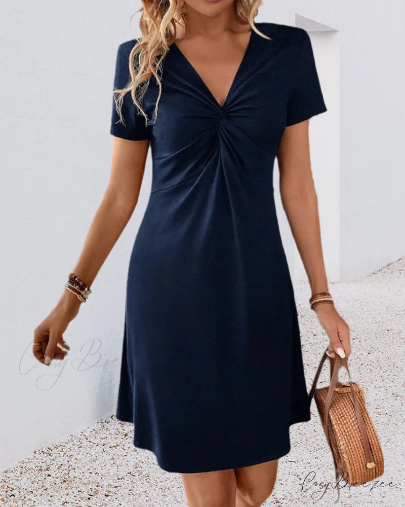 V Neck Dress with Twist Front Input: High Waisted Skinny Jeans Output: High Waisted Skinny Denim Pants Input: Floral