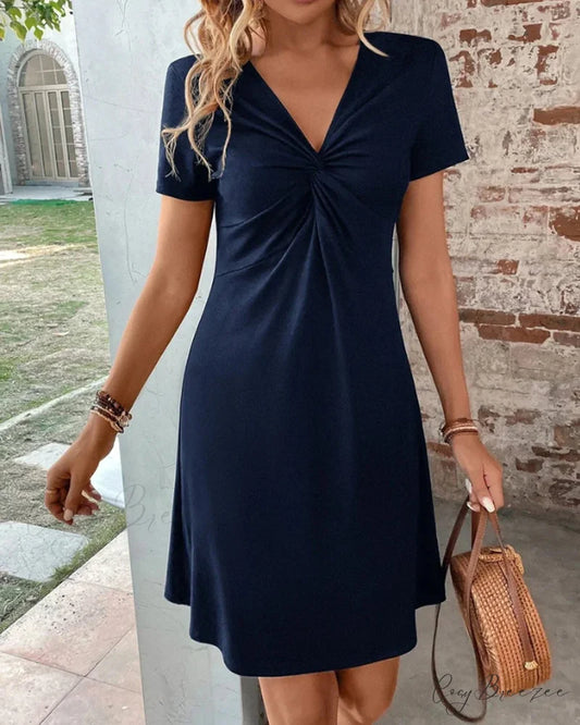 V Neck Dress with Twist Front Input: High Waisted Skinny Jeans Output: High Waisted Skinny Denim Pants Input: Floral